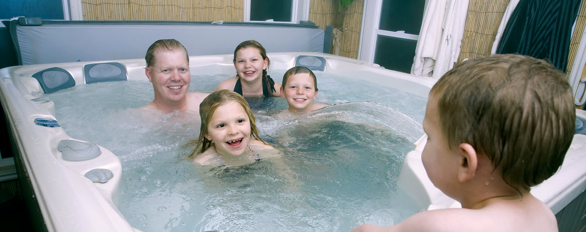 family in a hot tub