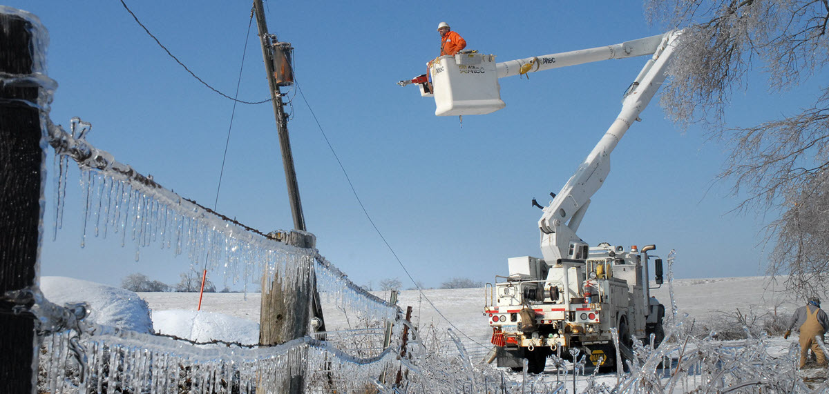 line worker in a bucket truck following an ice storm