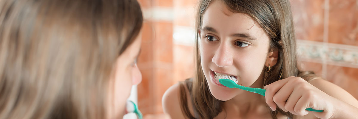 Girl brushing her teeth